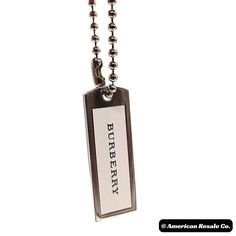 an american rescue company dog tag on a ball chain with the words burberry printed on it