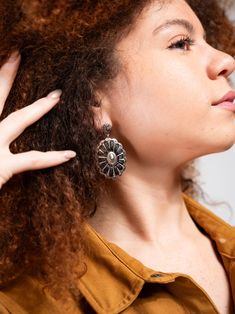 Expertly crafted with a Western-inspired design, these Concho Drop Earrings by Bowie are a sophisticated and versatile addition to any jewelry collection. Adorned with intricate wrapped details, they provide a polished touch to any outfit. Elevate your style with these unique earrings. SizeHEIGHT: 2"WIDTH: 1.25" QualityMade with premium materials for quality and endurance Imported E9520 Unique Teardrop Wrap Earrings, Oxidized Metal Drop Earrings, Unique Silver Wrap Earrings, Bohemian Sterling Silver Plug Earrings, Pierced Crystal Metal Earrings, Nickel-free Unique Earrings, Metal Teardrop Flower Earrings, Unique Dangle Wrap Earrings, Artisan Single Drop Earring