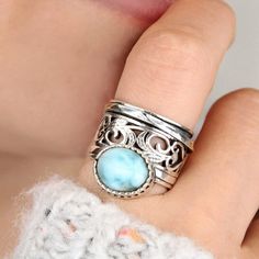 Beautiful filigree spinner ring with amazing natural Larimar stone. Made of solid sterling silver. **Each stone is unique, the buyer will get a random beautiful Turquoise from the current collection.** Gemstone: Larimar Ring size: Choose your size Magic Jewelry, Black Tourmaline Ring, Full Finger Rings, Silver Rings For Women, Larimar Ring, Moonstone Ring Sterling Silver, Larimar Rings, Silver Spinner Rings, Spinner Ring