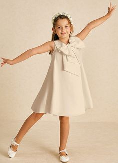 Zoey is a delightful A-line creation in matte satin, showcasing a charming scoop neckline and playful bows. With its sleeveless design, it’s perfect for adding a touch of elegance and fun to any wedding or celebration. Satin Flower Girl Dresses, Champagne Flower Girl, Flower Girl Dresses Champagne, Military Ball Dresses, Sage Dress, Special Event Dresses, Lace Bride, Rhinestone Dress, Ivory Dresses