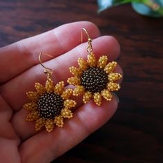 Two small and dainty sunflowers, hand beaded using hundreds of super-tiny glass beads, strung and stitched one at a time. Mini sunflowers measure just over 1 inch (28mm) each. Total length of earrings with ear wires: 1.5 inches (40mm.) © 2020-2021 Heart in Hawaii Available in larger size; sold separately Matching brooch available; sold separately Professionally handmade in the US Truly unique; exclusive design; direct from the artist Gift wrapping and 1st Class US shipping included Beaded Sunflower Earrings, Beaded Sunflower, Mini Sunflowers, Sunflower Earrings, Artist Gifts, Hand Beading, Ear Wires, Exclusive Designs, Floral Rings