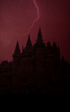 a lightning strikes over a castle in the sky