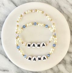 Lightweight MAMA, GIRL MOM, or BOY MOM accent bracelet. This listing is for ONE bracelet. Bracelets are crafted with black letter beads, 4mm pearl inspired beads, 3mm gold colored beads, and clear / light pink / light pink + blue / blue crystal inspired beads (depending on what you choose). 1. Select the accent crystal bead(s). Options include clear, light pink, light pink + blue, or blue. If you would like a combination not listed, please message me! 2. Indicate the name or word to personalize the bracelet in the Personalization Box. MAMA, BOY MOM, or GIRL MOM are examples of how you can personalize the bracelet. You may choose any name or word to personalize your bracelet.   *Please note - this bracelet is also available with gold letters.  A&M bracelets stretch and can be worn fitted or Mom Bracelet Ideas, Customizable Blue Jewelry For Mother's Day, Mother's Day Custom Name Stretch Bracelet, Blue Beaded Bracelets With Custom Name For Birthday, Blue Bracelets For Mother's Day Personalized Gift, Personalized Blue Bracelet For Mother's Day, Pink Beaded Bracelets With Name, Custom Name Blue Stretch Bracelet As Gift, Personalized Stretch Bracelet With Round Beads For Mom