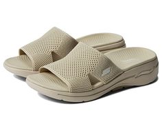 SKECHERS Performance Go Walk Arch Fit Knit Slide - Women's Shoes : Natural : Slide into instant comfort rocking the SKECHERS Performance Go Walk Arch Fit Knit Slide. These sandals are perfect for those warm weather days as they have materials that give amazing support for all day wear. They're super stylish and pair well with just about anything in the closet. Skechers Arch Fit insole system with podiatrist-certified arch support. Insole and outsole made of man-made material. Sketchers branding Comfortable Lightweight Slip-on Sport Sandals, Lightweight Comfortable Sport Sandals With Arch Support, Casual Breathable Comfortable Sport Sandals, Lightweight Slip-on Sport Sandals With Arch Support, Breathable Slip-on Sandals For Walking, Lightweight Casual Sport Sandals With Arch Support, Casual Comfortable Sport Sandals With Cushioned Footbed, Breathable Sandals For Summer Walking, Breathable Comfortable Sandals For Walking