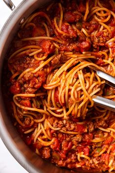 a large pot filled with spaghetti and meat