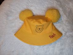 As seen on picture. Each hat is made by hand and hand crafted. One size 22.8 in in crown one size adult hats can fit ages 6 and up. Please make sure you check the size before ordering. And also please check adress when ordering Fun Adjustable Hats With Ears, Cute Yellow Adjustable Hat, Cute Yellow Adjustable Bucket Hat, Cute Adjustable Yellow Hat, Cute Adjustable Yellow Bucket Hat, Playful Yellow Hat One Size, Cute Mini Bucket Hat, Cute Handmade Yellow Hat, Pooh Decor