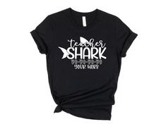 Teacher Shark Shirt, Teacher Doo Shirt, Back to School Shirt, Teacher Shirt, Gift for Teacher, Teacher Appreciation,Teacher Appreciation Tee * High quality and super soft, comfortable shirt. Made with top-of-the-line vinyl and pressed with a professional grade heat press. * Please check all color and size charts before place the order. Since all shirts are custom made based on your selection, I don't accept return or exchange unless there is an issue with your order. *We're working with different shirt brands based on the color/size availability. All shirts we use are soft style, not heavy cotton. Solid colors are all cotton and heather colors are cotton/poly blend. (there may be exceptions) *Our Sweatshirt 70% SoftLume combed and ring-spun cotton, 30% polyester fleece- with 100% SoftLume Pre-shrunk Graphic Tee For Teacher Appreciation, Black Shirt With Text Print For Teacher Appreciation, Custom Print Black Top For Teacher Appreciation, Custom Print Crew Neck Shirt For Teacher Appreciation, Black Custom Print Top For Teacher Appreciation, Black Top With Custom Print For Teacher Appreciation, Shark Shirt, Teacher Teacher, Cute Sweatshirts