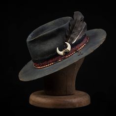 The Bandit Drifter is a 100% Wool Felt, Western high quality hat. Thick and durable and made to last a lifetime.Distressed fabric band with multiple layers of leather cord. The inside has a comfortable leather sweatband with a satin liner.Handmade, one of a kind from GrimHat.The size of the hatis based on the circumference of the head.In order to determine the proper hat size, you must measure your head.Use the table below to determine your hat size based on your measurements.Worldwide Shipping Distressed Adjustable Hats For Country Events, Adjustable Distressed Hats For Country Events, Adjustable Distressed Brimmed Hat, Vintage Leather Hat Band For Fall, Vintage Distressed Fedora Hat, Distressed Adjustable Flat Brim Hat, Adjustable Vintage Felt Hat For Fall, Distressed Flat Brim Hat With Adjustable Fit, Rustic Leather Fedora With Adjustable Fit