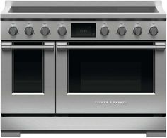 a stainless steel oven with two double doors and four burners on the front, side by side