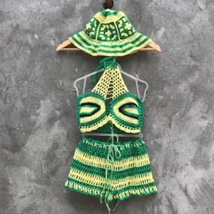 Rasta 3 piece crochet outfit Halter crop top, shorts and panama hat matching set Granny square crochet set woman Beach festival gift her Material: cotton, microfiber Colour: yellow, green and black Size: choose in variations! Pretty festival 3 piece rasta crochet outfit for woman. In this handmade unique outfit you will be unforgettable! Size chart women XS: Chest: 32.3"/ 82 cm Waist: 24.4"/ 62 cm Hips: 35.4"/ 90 cm S: Chest: 33.9"/ 86 cm Waist: 26"/ 66 cm Hips: 37"/ 94 cm M: Chest: 35.4"/ 90 cm Waist: 27.5"/ 70 cm Hips: 38.6"/ 98 cm L: Chest: 37.8"/ 96 cm Waist: 30"/ 76 cm Hips: 41"/ 104 cm XL: Chest: 40.15"/ 102 cm Waist: 32.3"/ 82 cm Hips: 43.3"/ 110 cm For more crochet outfits for women's, click here: https://www.etsy.com/shop/Garust?ref=seller-platform-mcnav&section_id=35266619 Garust Bohemian Green Summer Sets, Crochet Shorts For Beach Season, Crochet Beach Shorts For Beach Season, Beach Season Crochet Shorts, Crochet Shorts For Summer Vacation, Summer Beach Shorts With Crochet Details, Spring Beach Crochet Shorts, Green Two-piece Set For Vacation, Green Two-piece Vacation Set