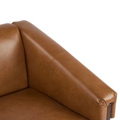 a brown leather chair with the seat folded back and arm rests down on an isolated white background