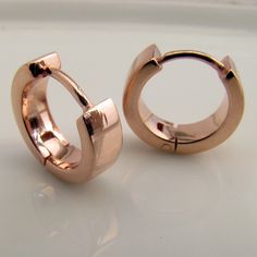 These rose gold plated men's hoop earrings are made from sterling silver. These men's hoop earrings are size M and 3mm wide. Our medium sized men's hoop will leave a small gap between the hoop and earlobe for most people. Sold as a single earring or as a pair. SPECIFICATION Base metal: Recyclable fine 925 Sterling Silver Outer layer: 18K rose gold, thick coating Outer Diameter: 12mm (medium hoop size) Inner Diameter: 8mm Width: 3mm Ear post gauge: 20G, standard Other sizes Large hoops https://ww Classic Rose Gold Hypoallergenic Huggie Earrings, Classic Hypoallergenic Rose Gold Huggie Earrings, Rose Gold Tarnish Resistant Huggie Jewelry, Rose Gold Tarnish Resistant Huggie Earrings, Modern Rose Gold Huggie Earrings, Hypoallergenic Rose Gold Huggie Earrings, Classic Rose Gold Sterling Silver Cartilage Earrings, Tarnish-resistant Rose Gold Huggie Hoop Earrings, Modern Shiny Huggie Jewelry