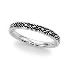 a white gold wedding band with black diamonds in the shape of an interlocked design