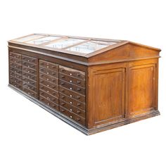 an old wooden dresser with glass doors and drawers on the bottom shelf, isolated against a white background