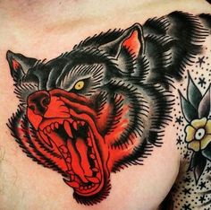 a man's chest with an angry bear tattoo on it