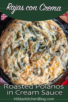 a skillet filled with roasted potatoes and cream sauce on top of a checkered table cloth