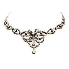 Edwardian Silver over Gold, Flexible Diamond Necklace in its original fitted box from A. Leroux, 1 Rue Dumes, Le Mans, with 11 European cut round diamonds prong set, H-I color, VS-SI clarity, weighing about 2.75 carats total, and 300 rose cut diamonds, prong and bezel set, H-I color, VS-SI clarity, weighing about 4.50 carats total. Edwardian Necklace, Bezel Set Necklace, Diamond Flower Pendant, Vintage Choker Necklace, Silver Diamond Necklace, Edwardian Jewelry, Round Necklace, Gold Diamond Jewelry, Gold Diamond Necklace