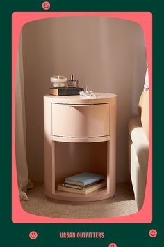 an image of a nightstand with books on it