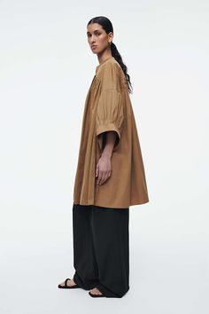 PLEATED MINI TUNIC DRESS - LIGHT BROWN - Dresses - COS Spring Dresses With Pleated Sleeves, Summer Workwear Tunic In Relaxed Fit, Summer Workwear Tunic With Relaxed Fit, Relaxed Fit Summer Tunic For Workwear, Oversized Tunic For Spring Daywear, Oversized Spring Tunic For Daywear, Modern Dresses For Fall Daywear, Modern Fall Dress For Daywear, Modern Fall Daywear Dress