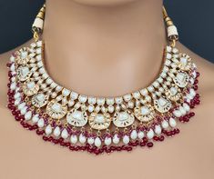 Bridal Ruby Red Fine Kundan Indian Bridal Necklace, Wedding necklace, Fine kundan jewelry, Pakistani Jewelry, Indian Jewelry, Bridal Jewelry Rose Gold-plated foiled Kundan necklace set.  Regular Size And Adjustable Ships from California, USA Delivery in 2-5 business days in the USA. Other designs can be found here https://www.etsy.com/listing/1381240765/premium-quality-gold-plated-silver?click_key=e1a9e46c1ba3dcb2d7ddeb00610b709b7497bd62%3A1381240765&click_sum=5b5797e9&ref=shop_home_active_511&p White Ruby Necklaces For Wedding, Red Kundan Bridal Set For Ceremonial Use, Ceremonial Red Kundan Bridal Set, Traditional Red Bridal Sets For Reception, Heavy Red Kundan Necklace For Wedding, Red Meenakari Bridal Necklace For Wedding, Ruby Temple Necklace For Wedding And Festivals, Wedding Ruby Temple Necklace For Festivals, Traditional White Ruby Bridal Necklace