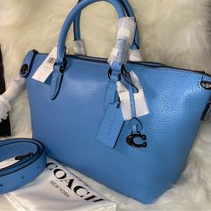 Coach Cara Satchel New With Tags And Original Packaging Dust Bag Included 100 % Authentic Pool Color With Pewter Color Hardware Soft Pebble Leather Zip Closure Handles With 4 1/2" Drop Long Strap With 21 1/2" Drop Included Four Protective Feet At Base Approximate Measurements 10 1/2" L X 7 1/2" H X 5 1/2" W Smoke And Pets Free Blue Formal Satchel With Branded Hardware, Blue Leather Satchel With Branded Hardware, Blue Textured Leather Shoulder Bag For Shopping, Light Blue Leather Satchel With Top Handle, Light Blue Leather Bag With Branded Hardware, Light Blue Satchel With Detachable Handle, Blue Leather Bags With Branded Hardware, Blue Textured Leather Top Handle Satchel, Light Blue Leather Satchel With Detachable Strap