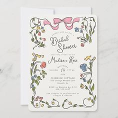 a wedding card with flowers and bows on the front, in pastel pinks