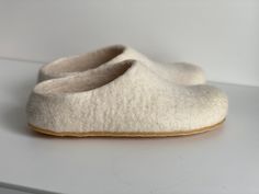 These slippers designed with love for cozy home feeling anywhere you are! Durable wool slippers(shoes) will make you feel relaxed.  Sustainable, comfy, easy slip on and soft. White creamy colour for people who likes to look neat. Natural eco wool, so coziness guaranteed! Who made it ? In co-operation with my partner - making them with love for you - these slippers  Preparation time ? Slippers preparation time are 1-2 weeks, but most of them are shipped within 6 days! Are they comfy? Yes, yes, ye Comfortable Soft Closed Toe Slippers, Cream Round Toe Indoor Slippers, Comfortable White Slippers With Soft Sole, White Comfortable Slippers With Soft Sole, Comfortable Soft White Slippers, Comfy Soft White Slippers, Soft Cream Round Toe Slippers, Comfortable Cream Slippers With Round Toe, White Soft Sole Slippers For Winter