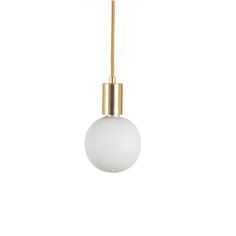 a white ball hanging from a gold colored cord