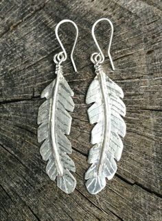 Large Sterling silver 2 inch earrings are hand cut from Sterling silver sheet, fused, hand forged with a vein, hand engraved, and polished to a high shine. They are also available in polished brass and there is also a large 3 inch matching pendant in sterling silver or polished brass. Easy Jewelry Making Ideas, Large Feathers, Easy Jewelry, Beautiful Mask, Pretty Necklaces, Sterling Silver Dangle Earrings, Feather Earrings, Gold Wedding Band, Favorite Rings