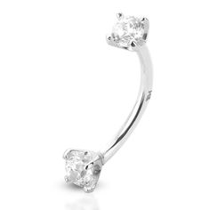 a white gold nose ring with an oval cut diamond in the middle and two smaller round diamonds on each side