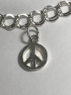 Peace sign still as popular today as ever. A great addition to any charm bracelet. Classic Everyday Charm Bracelet, Everyday Classic Charm Bracelet, Everyday Silver Charm Bracelet With Lobster Clasp, Everyday Sterling Silver Charms With Lobster Clasp, Classic Everyday Sterling Silver Charms, Symbolic Sterling Silver Charm Bracelets, Everyday Silver Dangle Charms, Classic Sterling Silver Charm Necklace, Classic Silver Charms For Everyday