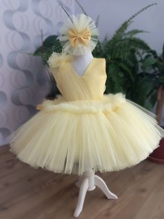 THİS DRESS IS READY TO SHIP IN 1 DAY. ❤️Make your little one's special occasion truly unforgettable with our breathtaking yellow tutu tule dress! Crafted from high-quality tule fabric, this adorable dress features layers of soft, fluffy tule that create a magical, princess-like appearance. The elastic waistband ensures a comfortable and secure fit for your baby or toddler, allowing them to move freely and enjoy their special day.  ❤️Perfectly suited for a wide range of events, from first birthdays and toddler parties to photo shoots and pageants, this versatile dress is a must-have for any little girl's wardrobe. The vibrant yellow hue adds a cheerful and festive touch, making it an excellent choice for milestone celebrations and capturing precious memories. Designed with an eye for detail Yellow Tulle Wedding Dress, Elegant Yellow Tutu Dress For Wedding, Elegant Yellow Princess Dress For Pageant, Elegant Yellow Tulle Princess Dress, Elegant Yellow Tulle Tutu Dress, Yellow Tutu Dress For Birthday, Yellow Princess Dress For Birthday In Spring, Elegant First Birthday Tulle Tutu Dress, Yellow Ruffled Tutu Dress For Wedding