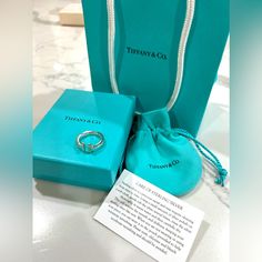 Brand New, Never Worn, Tiffany & Co Ring In Silver. Size 6. With Original Packaging: Box, Pouch, Authenticity Card, And White Ribbon. Tiffany Co Rings, Jewelry Tiffany, Tiffany T, Box Pouch, Square Ring, 6 Rings, Square Rings, Tiffany Co Jewelry, White Ribbon