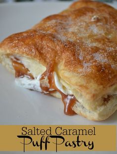 a pastry with caramel sauce on it sitting on a white plate next to the words salted caramel puff pastry