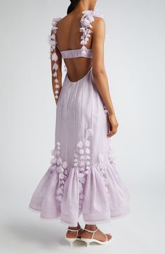 Encased in corsetry, this romantic linen-and-silk gown is softened with cascades of fluttery organza petals and a bouffant flounce edged with delicate fringe. 39" center front length (size OP/2) Hidden back zip; back strap with hook-and-eye closure Sweetheart neck Adjustable tie spaghetti straps Lined 53% linen, 47% silk Dry clean Imported Designer Clothing Strap Ideas For Dress, Painted Silk Dress, Flower Wedding Guest Dress, Pastel Purple Wedding Dress, Linen Moodboard, Garden Party Wedding Outfit Guest, Linen Gown, Zimmerman Dress, Silk Corset