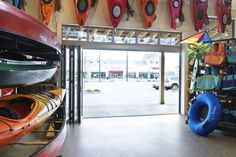 there are many kayaks on display in the store