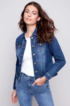 Charlies B's Denim Jean Jacket is a classic denim jacket style with brass hardware and a tailored look. Made in a stretchy cotton jean fabric that is soft and comfortable. A perfect go-to topper for just about any outfit! Updated cropped length falls just over waist on most. Vintage wash indigo. Two front chest pockets and two side pockets.Made in ChinaFabric: 73% Cotton, 23% Polyester, 3% Viscose, 1% SpandexCare: Wash Gentle, Hang to DrySize Medium (M): Bust 38", Hip 38", Length 21"