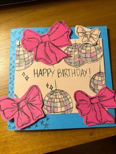 a birthday card with pink bows on it