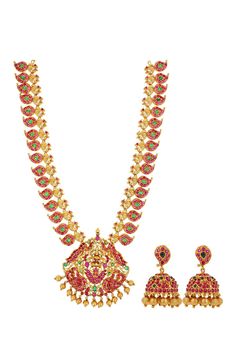 Gold toned brass necklace with carved temple motifs, stone embellishments and bead drops. Comes with jhumkis.
Components: Necklace, Pair of earrings
Type: Stone and Beads
Composition: Brass
Color: Gold
Dimensions L x B (cms):
Necklace: 36 x 7
Earrings: 4 x 1
Weight (gms): 135
Closure:
Earrings: Push back clasp
Note: Bangles worn by the model are not for sale - Aza Fashions Temple Jewelry Style Necklace With Latkans For Celebration, Temple Jewelry Necklace With Latkans For Celebrations, Temple Necklace With Latkans For Celebration, Temple Jewelry Sets With Latkans For Rituals, Temple Jewelry Necklace With Stone Work For Celebration, Navratri Temple Jewelry Necklace With Stone Work, Temple Jewellery Set, Temple Motifs, Jewellery Set Gold