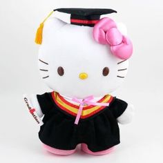 a hello kitty stuffed animal wearing a graduation outfit