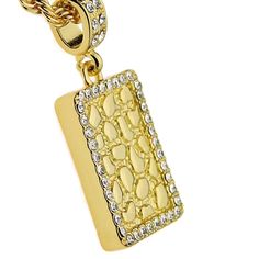 Get your shine on with a square nugget design pendant rope chain necklace. Twisted rope chain is 24" long x 4 mm wide, stylish lobster claw clasp closure. Square nugget pendant is approx 21MM wide x 29MM tall, encrusted with round cut stones around the perimeter. Yellow gold finish over a high quality base metal core, chunky piece weighs 40 grams. Enjoy 100% FREE SHIPPING in the USA. Rectangular Metal Jewelry With Adjustable Chain, Metal Jewelry With Rectangular Pendant Chain, Metal Rectangular Pendant Chain Jewelry, Rectangular Metal Necklace With Adjustable Chain, Rectangular Metal Chain Necklace With Adjustable Chain, Rectangular Chain Necklace For Gift, Gold Jewelry With Lobster Clasp And Rectangular Pendant, Rectangular Pendant Necklace With Box Chain, Gold Jewelry With Rectangular Pendant And Lobster Clasp