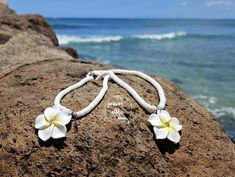 Aloha, beach lovers! 🌺 Dive into island magic with our Plumeria seashell necklace! Inspired by the vibrant beauty of the Hawaiian Islands, this charming accessory brightens up your everyday outfits, whether you're lounging by the waves or enjoying a sunset cocktail. Imagine wearing a stunning, handmade plumeria blossom that sparkles like sunlight on the ocean. Each flower is crafted with care, making every necklace uniquely yours! With whimsical seashell beads, this piece captures the essence of paradise and is sure to invite compliments wherever you go. Elevate your accessory collection with our Plumeria seashell necklace and let the spirit of the islands shine through in your everyday style! 🌟 Special Offer: Enjoy our BUY MORE, SAVE MORE ON SHIPPING deal! 😄 Please note that colors may Sunset Cocktail, Necklace Seashell, Hawaiian Necklace, Hawaiian Jewelry, On The Ocean, Seashell Jewelry, Necklace Flower, Seashell Necklace, Jewelry Beaded