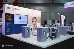 a booth at a medical exhibition with electronic devices on display