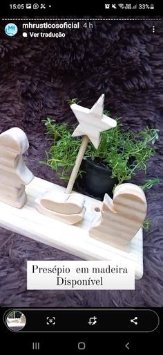 a wooden toy sleigh with plants in it