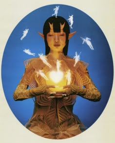 a woman holding a lit candle in her hands