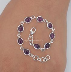 Amethyst Bracelet / 925 Sterling Silver Bracelet / February Birthstone Bracelet / Gemstone Bracelet / Handmade Silver Jewelry / Gift For Her Gemstone Name - Amethyst  Stone Quality - AAA Bracelet Weight - 4.27 gm Stone length :- 7 MM, Stone Width :- 5 MM Bracelet Length - 6 inch to 9 inch sizes are available, we give 0.5 inch adjustable in the size which you order ( NOTE - 0.5 INCH ADJUSTABLE IS INCLUDED IN YOUR ORDERED SIZE ) Stone Shape - As shown in the picture You'll get the exact product as shown in the pictures We serve complete 925 sterling silver Jewelry and genuine properties of the stone. The products are dispatched from the small business from USA. Product Quality and Packaging - Our all products are 925 Silver Stamped which shows that the product is genuine and authentic .The p Sterling Silver Gemstone Chain Bracelet As Gift, Silver Dainty Gemstone Bracelets, Sterling Silver Crystal Bracelet With Natural Stones, Silver Dainty Gemstone Bracelet, Sterling Silver Stone Bracelets As Gift, Dainty Silver Bracelet With Gemstone, Dainty Silver Gemstone Bracelet, Purple Sterling Silver Round Bracelets, Adjustable Purple Gemstone Sterling Silver Bracelet