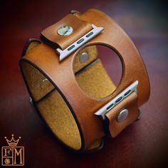 "This applewatch Caramel brown leather watch cuff is custom dyed by hand using european vegetable tanned leather . It features two included applewatch connectors and uses two straps. Two quality stainless steel buckles provide the closure! A great width for any wrist! This cuff is inspired by the early Johnny Depp cuffs. can be used with or without a watch! Custom sized for your wrist! Please use the instructions above! I'll need the size/series applewatch and the case finish color ( matte, shin Modern Brown Watch Accessories With Waxed Finish, Vintage Brown Leather Strap Watch Accessories, Vintage Brown Watch Accessories For Gift, Handmade Modern Brown Cuff Bracelet, Modern Handmade Brown Cuff Bracelet, Vintage Leather Apple Watch Band With Bracelet Strap, Vintage Leather Bracelet Strap For Apple Watch, Vintage Brown Leather Watch Band, Classic Brown Leather Strap Cuff Bracelet