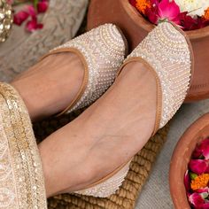 An all-year-round shoe! It's feminine, delicate and subtle. The multi-colour design leaves a lot of room for imagination in terms of styling. Slip these on with a butter-yellow Lucknowi saree or pair them with a blush-coloured kurta...you are sure to cut a dash regardless of how you style these! Outer material: Dupion Inner material: Genuine Leather Color: Blush Pink Type of work: Pearl and glass beads Care: Dry Clean only.If the shoe gets wet, remember to first dry in the sun before putting it back in the closet. Indian Sandals, Fancy Sandals, Indian Shoes, Women Slippers Fashion, Punjabi Jutti, Bridal Shoes Flats, Bridal Sandals, Hyde Park, Footwear Design Women