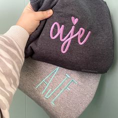 If it isn't monogrammed, is it really even yours? Our embroidered monogram sweatshirts are cozy and soft. ♥ AS SEEN IN LISTING PHOTOS ♥ - Dark Heather Sweatshirt, Kellen font, Lavender thread - Sport Gray Sweatshirt, Farmhouse font Aqua thread ♥ DETAILS ♥ - Crewnecks are true unisex in size. - 7.8-ounce, 50/50 cotton/poly fleece. - Due to stock issues with suppliers, different brands may be used to fulfill orders. Gildan/Port & Company/Jerzees are the brands we normally use, unless otherwise noted in the listing. All sweatshirts used will be high quality.    ♥ QUESTIONS? ♥ - Send me a message through Etsy messages and I will be happy to help. Please allow 24 hours for a response; if you do not hear back within 24 hours please send me an updated message.  ♥ STAY SOCIAL ♥ - VIP Group - https Ladies Christmas Shirts, Monogram Hoodie, Monogram Sweater, Farmhouse Font, Christmas Movie Shirts, Embroidered Items, Monogram Sweatshirt, Mom Fashion, Embroidery Monogram