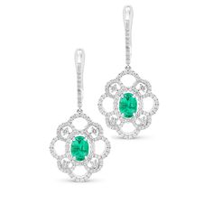 Treat the May birthday girl to fabulous flower-shaped drop earrings she'll love to wear. Crafted in 18K white gold, this eye-catching design features an oval-shaped green emerald wrapped in a halo surrounded by a diamond-adorned open flower setting. These feminine earrings are sure to delight. The drops suspend from diamond-lined posts that secure comfortably with English lock backs. 1.57-carat Oval-cut Emeralds 1.19-carat white diamonds 18K white gold The earring design can be customized to sui Vintage Diamond Earrings, Flower Setting, Emerald Diamond Earrings, Feminine Earrings, Bridal Wedding Earrings, Open Flower, May Birthday, White Gold Earrings, Emerald Earrings